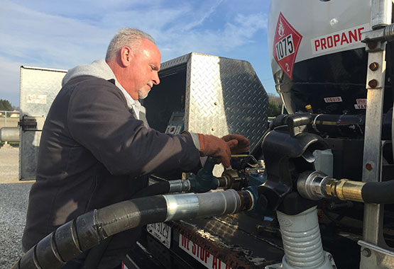 photo of Gary filling a propane tank